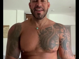 Viktor Rom, the tattooed gay porn star, gives a raw and intense performance in a scene where he dominates a jock-wearing hunk while his wife watches.