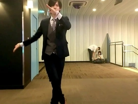 Japanese duo with elderly man performing dance routine
