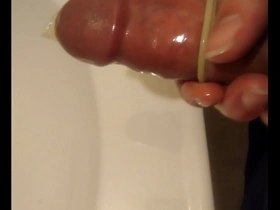 Solo pleasure with a Japanese cock size masturbator with condom use