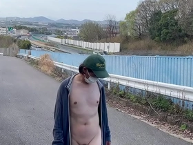 Mayu-chan, a female crossdresser, likes to be naked outdoors and not only get attention from cars and people driving by but also from other people.