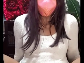 Chika the masked crossdresser masturbates while live streaming.