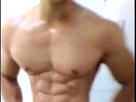 Muscular Asian man ejaculates