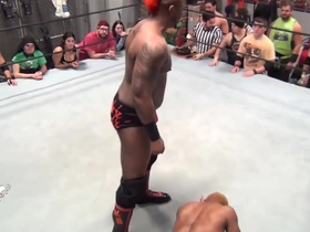 Gay black men engage in wrestling matches.