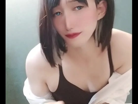 Cross-dressing Japanese sissy femboy in erotic video