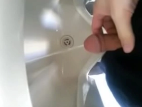 Solo boy pisses in the bathroom