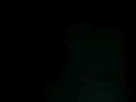 A gay man masturbates at night while wearing black pantyhose.