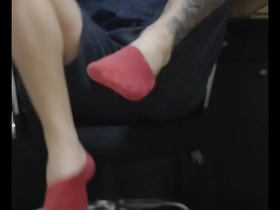 Office worker has his feet worshipped by coworker in gay scene.