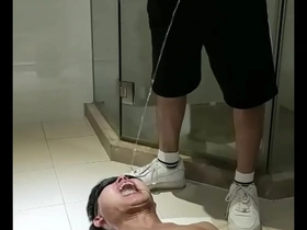 Gay toilet slave in Asian piss spit scene