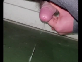 Gay Japanese man masturbates while bent over.