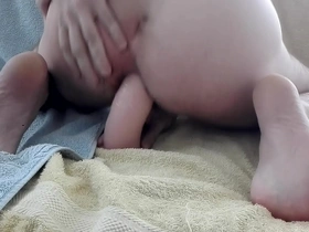 Gay man enjoying dildo in his anus